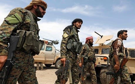 Members of the SDF pictured this week in Deir ez-Zor. Photo: Delil Souleiman/AFP