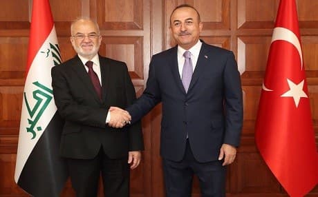 Iraqi Foreign Minister Ibrahim al-Jaafari and Turkish Foreign Minister Mevlut Cavusoglu shake hands in Ankara. Photo: Mevlut Cavusoglu/Twitter