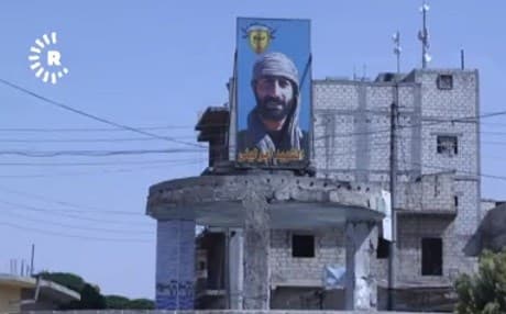 The image of YPG hero Abu Leyla who died in the war against ISIS in Manbij looks out over the city. Photo: Rudaw 