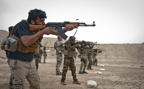 A firing line of Syrian Democratic Forces undergoes marksmanship training exercise to prepare for Operation Roundup near Shaddadi, Syria, May 27, 2018. Photo: Staff Sgt. Timothy R. Koster | US Army