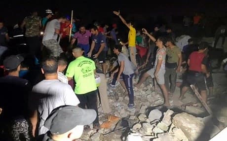 People look for missing victims after explosions in Sadr City, Baghdad on June 6, 2018. Photo: Ali Abdul Hassan | AP
