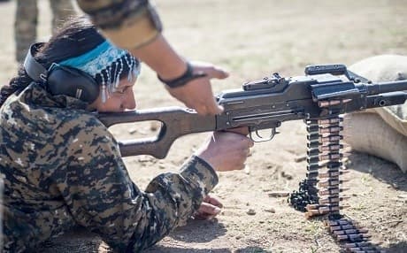A local female Manbij Military Council trainee fires a 7.62mm PK machine gun during marksmanship training Feb. 21, 2017, at Sanaa Training Center in northwest Syria. Photo: Master Sgt. Mark Burrell | US Army