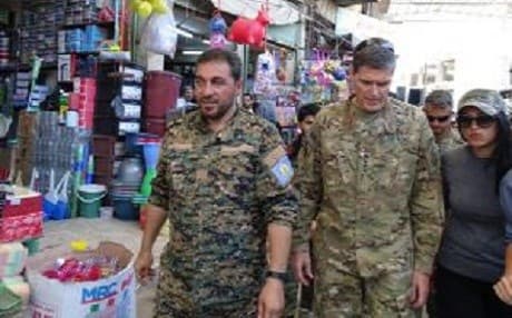 Manbij Military Council commander Mohammed Abu Adil and US Gen. Joseph Votel walk through Manbij bazaar. Photo: MMC
