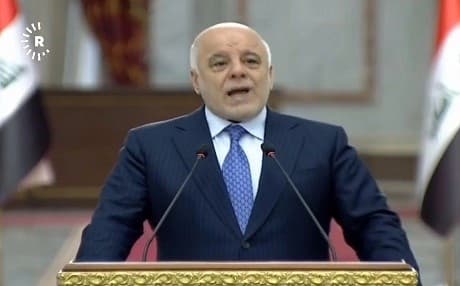 Iraqi Prime Minister Haider al-Abadi delivers remarks from Baghdad on July 3, 2018, during his weekly press conference in the Iraqi capital.