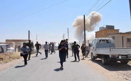 People run after an explosion in Haya, Syria, on July 5, 2018. Photo: Rudaw TV