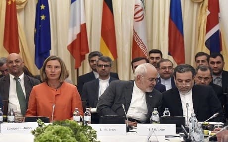 European Union High Representative for Foreign Affairs Federica Mogherini (left); Iranian Minister of Foreign Affairs Mohammad Javad Zarif (center) and political deputy at the Ministry of Foreign Affairs of Iran Abbas Araghchi take part in a Comprehensive Plan of Action ministerial meeting on the Iran nuclear deal on July 6, 2018 in Vienna, Austria. Photo: Hans Punz | AFP