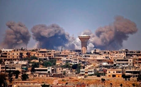 Smoke rises above rebel-held areas of the city of Daraa during reported airstrikes by Syrian regime forces on July 5, 2018. Photo: Mohamad Abazeed / AFP