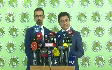 PUK politicians Khalid Shwani and Rebwar Taha tell reporters on July 8, 2018, that their party will sue any other parties who alleged they committed fraud in Kirkuk during the parliamentary election. Photo: Rudaw TV