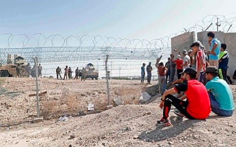 Protesters demonstrate against unemployment in front of oil fields in al-Qurnah, some 100 kilometers north of Basra, on Saturday. Photo: Haidar Mohammed Ali/AFP