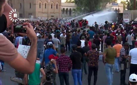 Security forces used water cannons to disperse protesters in Baghdad on Friday. Photo: Rudaw