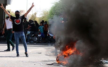 Protesters in Basra blocked streets with burning barricades earlier this month. Photo: Haidar Mohammed Ali/AFP