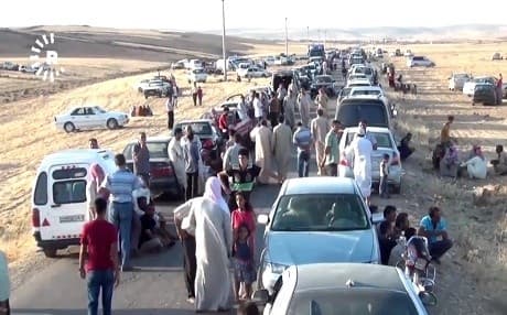 Yezidis flee Shingal by car and foot in August of 2014. File photo: Rudaw