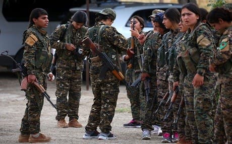 Fighters from the Kurdish female Women's Protection Units (YPJ) gather during an exercise at at a training facility in the northeastern Syrian Kurdish town of Derik, known as al-Malikiyah in Arabic, on June 1, 2017.  Photo: Delil Souleiman | AFP