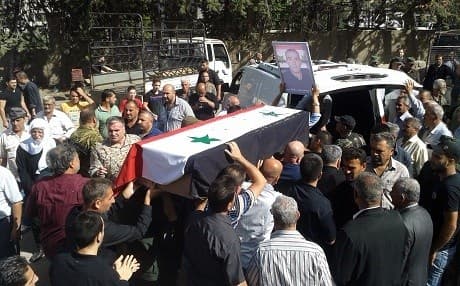 In this handout file photo taken on July 26, 2018, released by the official Syrian Arab News Agency (SANA), Syrians carry the coffin of a victim of suicide attacks during a mass funeral in the southern city of Sweida. File photo: AFP/SANA