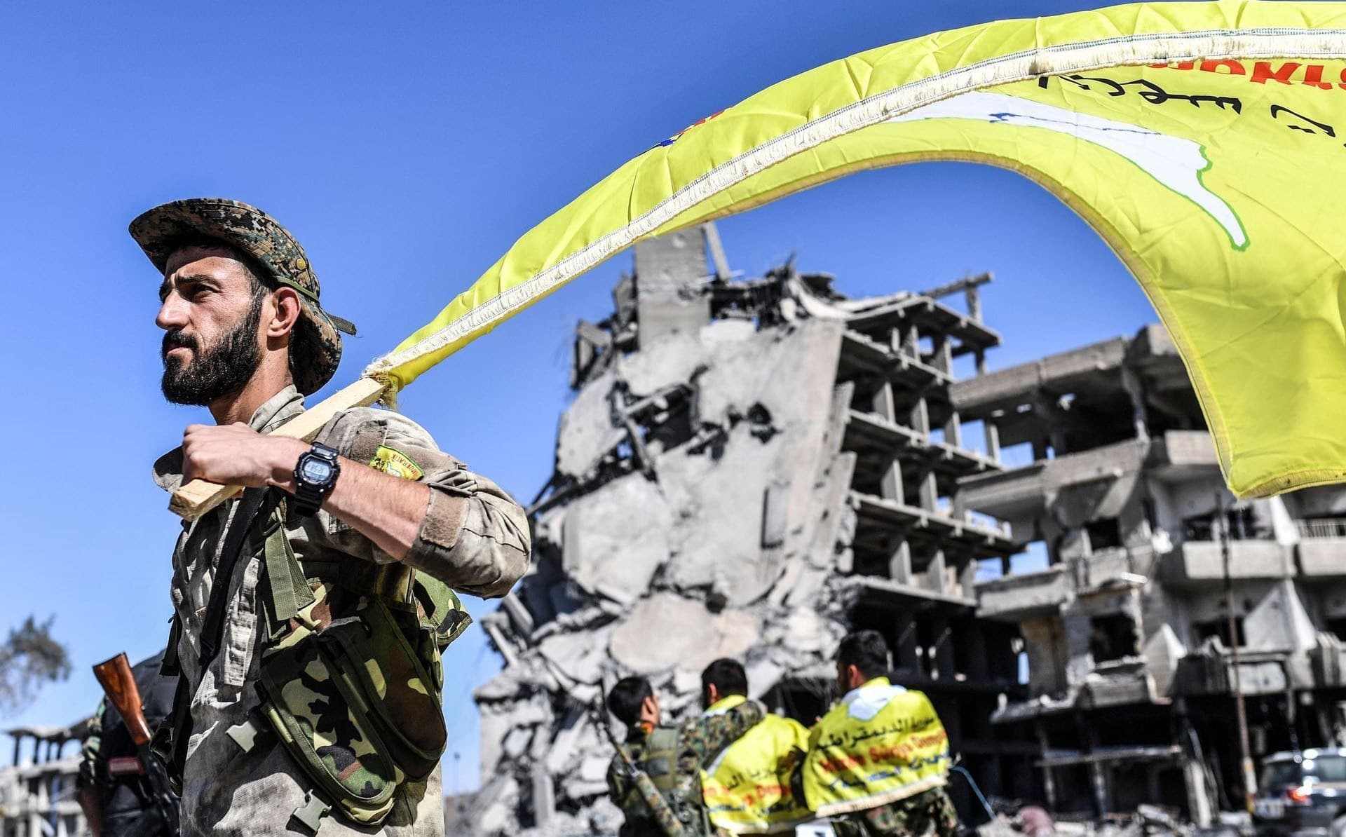 A member of the SDF in Raqqa's al-Naim square after announcing the city's liberation from ISIS last week. Photo: Bulent Kilic / AFP