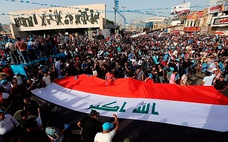 Iraqis rally prior to the May 2018 election at Tahrir Square in the Iraqi capital city of Baghdad. Photo: Hadi Mizban | AP