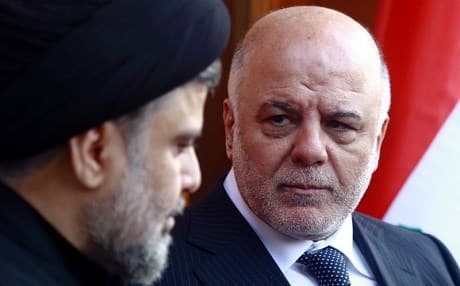 Iraqi Prime Minister Haider al-Abadi (R) pictured with cleric Moqtada al-Sadr in Najaf in 2015. File photo: Haidar Hamdani / AFP