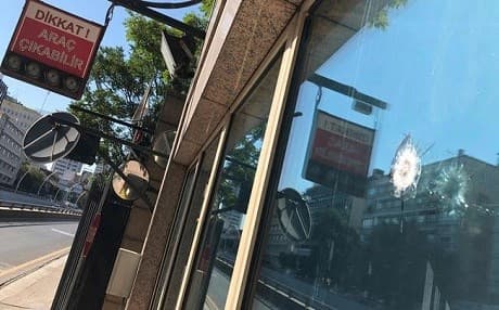 The damage to a security booth by a shot fired is seen outside the U.S. Embassy in Ankara, Turkey, Monday, Aug. 20, 2018. Photo: Burhan Ozbilici |  AP