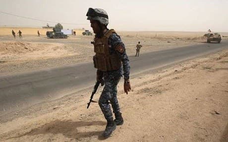 An Iraqi soldier patrols a road leading to the northern town of Hawija. AFP file photo