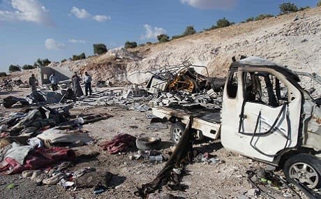Syrians check the wreckage at a site in Hass town after an airstrike by pro-regime forces on the south of Idlib province on September 8, 2018. Photo: Amer Alhamwe / AFP 