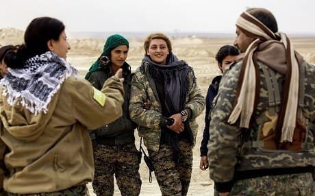 Members of the SDF speak on the outskirts of Raqqa in early 2017. File photo: Delil Souleiman/AFP