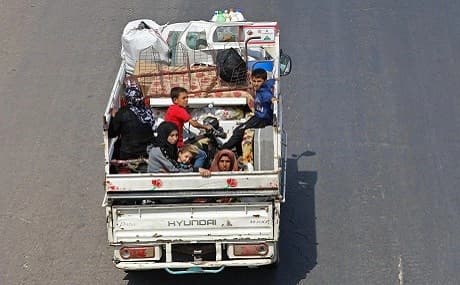Idlib civilians flee toward the Syrian-Turkish border, September 10, 2018. Photo: Omar Haj Kadour / AFP