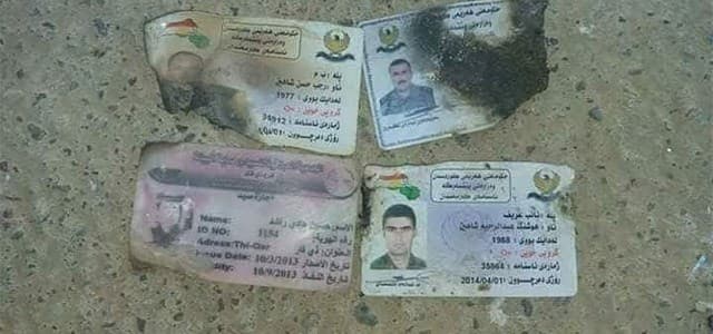 ID cards reportedly found with the bodies suggest the deceased include three Kurdish Peshmerga and one Arab civilian. Photo: Hashd al-Shaabi