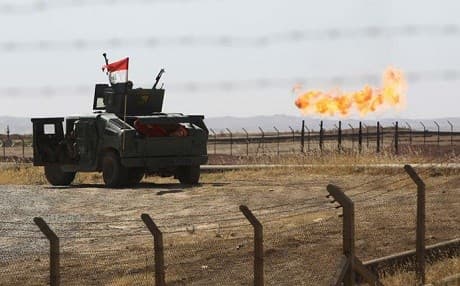 An Iraqi military vehicle is parked at an oil field in Kirkuk on October 16. Photo: AFP