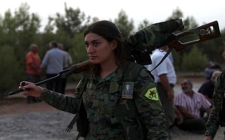 A figher from the Syrian Democratic Forces (SDF) attends the funeral of four fellow fighters in the northeastern city of Qamishli on September 14, 2018. The comrades were killed in the fight for Hajin days earlier. Photo: Delil Souleiman | AFP