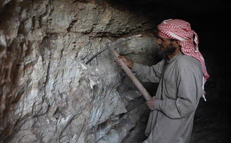 A man uses a pickaxe to dig a cave in the Syrian village of Kafr Ain in the southern countryside of the rebel-held Idlib province on September 15, 2018. Photo: Omar Haj Kadour | AFP