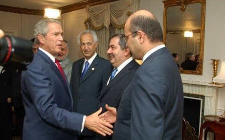 Barham Salih (R) shakes hands with former US President George W. Bush in this undated photo shared by CDJ. Photo: Hawpaimani