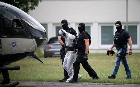 German police escort Ali Bashar, accused of killing a German teenager, in this photo taken June 10, 3018 in Wiesbaden, western Germany. Photo: Hasan Bratic/dpa/AFP