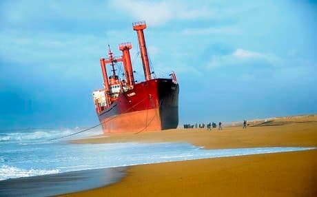 In this image taken on December 16, 2011, the Maltese TK Bremen cargo ship ran aground, spilling oil off the coast of France's northwestern region of Brittany and stranded on Kerminihy beach in Erdeven. File photo: Damien Meyer | AFP