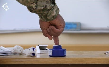 A member of the Kurdish security forces casts his ballot. File photo: Rudaw