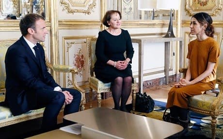 French President Emmanuel Macron (L) speaks with 2018 Nobel peace prize Iraqi Yazidi human rights activist Nadia Murad (R), during a meeting at the Elysee palace in Paris, on October 25, 2018. Photo: Etienne Laurent/AFP