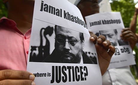Members of the Sri Lankan web journalist association hold placards with the image of Saudi journalist Jamal Khashoggi during a demonstration outside the Saudi Embassy in Colombo, October 25, 2018. Photo: Lakruwan Wanniarachchi / AFP 