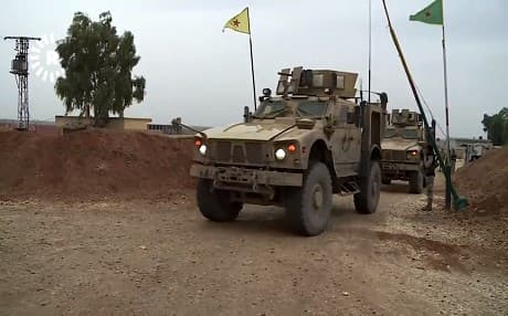 Coalition armored troop carriers pass through a YPG checkpoint in Hasakah governorate, Syria, on November 4, 2018. Video: Rudaw TV