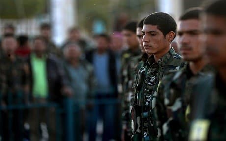 Syrian Democratic Forces attend the funeral of a fellow fighter in the northern Syria Kurdish town of Kobane on November 6, 2018, who was killed in an offensive by ISIS against an SDF position near Deir ez-Zor. Photo: Delil Souleiman | AFP