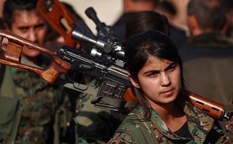 A Syrian Democratic Forces (SDF) fighter attends the funeral of a fellow fighter, November 11, 2018. Photo: Delil Souleiman / AFP 