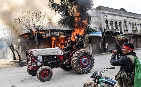 Turkish backed Syrian proxies who seized Afrin city center photographed looting businesses and belongings. File photo: AFP