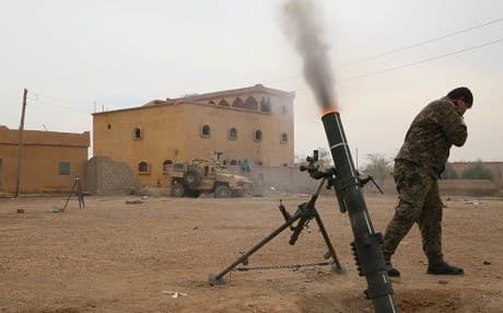 An SDF fighter fires a 120mm round near Hajin, Syria on November 19, 2018. Photo: US Army Spc. Christian Simmons/US Army