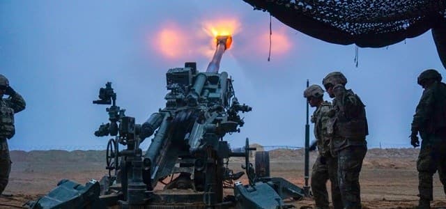 US Army troopers fire a M777 Howitzer at Firebase Saham on December 2, 2018 on Iraq's border with Syria where US and Iraqi forces secure the border from ISIS militants fleeing the battlefield in Syria. Photo: US Army/Capt. Jason Welch