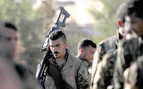 SDF fighters attend a funeral in Qamishli, October 29, 2018. Photo: AFP 