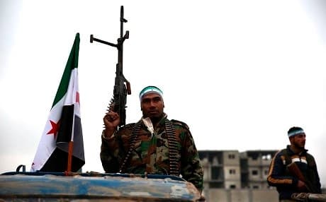 Turkish-backed Syrian fighters are pictured at their barracks in the rebel-held border town of Jarablus on December 25, 2018. Photo: Nazeer al-Khatib/AFP
