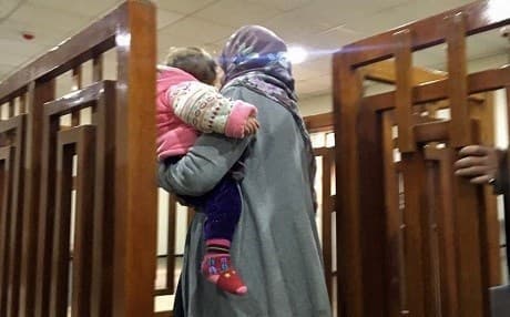 A foreign ISIS female member walks into a court room in Baghdad on February 20, 2018. Photo: AFP | stringer