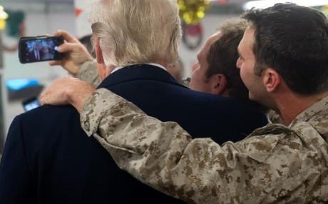 US President Donald Trump with member of the American military in al-Asad base in Iraq during his Christmas visit. AP phooto