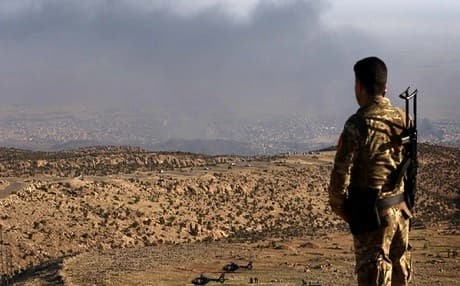 A Peshmerga soldier looks out over Shingal. AFP file photo