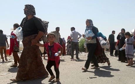 Yezidis flee just ahead of ISIS in August 2014. File photo: Ahmed al-Rubaye | AFP