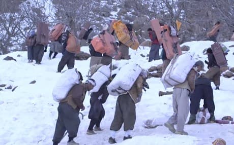 Kurdish porters trek through the night to earn living in Iran