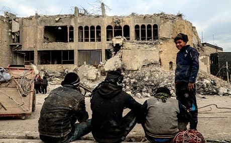 Iraqis scavenge for metal from the rubble of the destroyed seven-storey Chadirji Building, designed by celebrated Iraqi architect Rifat Chadirji in the 1960s, in the city of Mosul, January 13, 2019. Photo: Zaid al-Obeidi / AFP